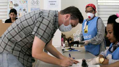 Con tapabocas y distanciamiento social: República Dominicana va a elecciones generales en medio de la pandemia