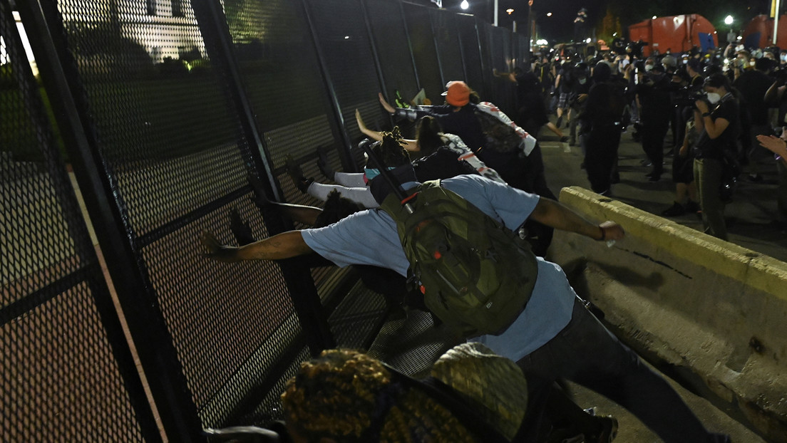 People protest after a Black man identified as Jacob Blake was shot several times by police in Kenosha