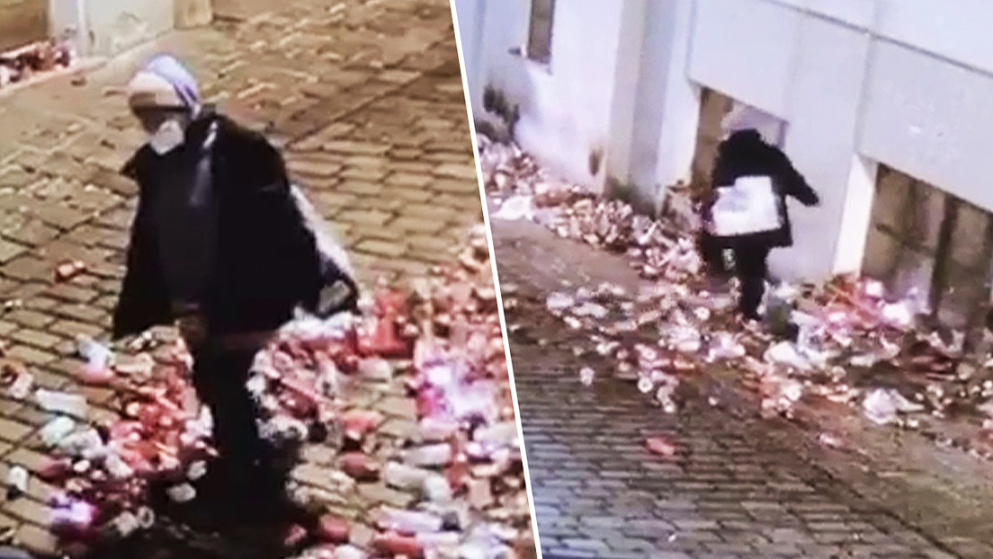 FOTOS: Una mujer patea las velas y flores en honor a las víctimas del atentado en Viena