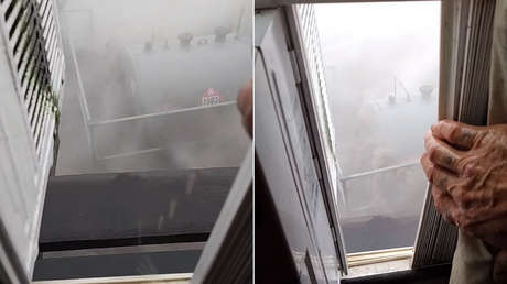 Abre una ventana en Luisiana durante el paso del huracán Ida y fuertes ráfagas de viento la arrancan