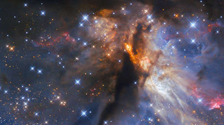 El Hubble capta una joven estrella masiva escondida en una nebulosa oscura (FOTO)