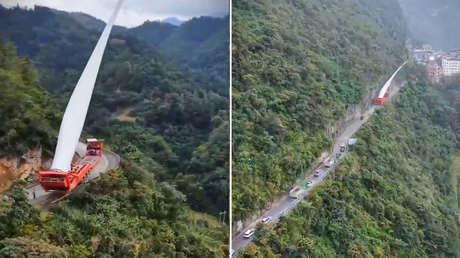 Camionero chino hace lo imposible para llevar una colosal pala de turbina por una montaña (VIDEO)