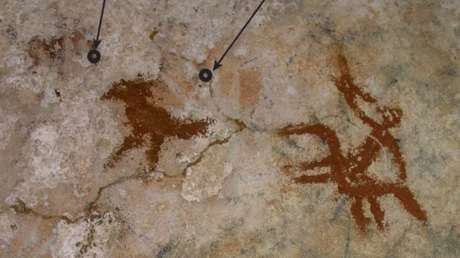 Descubren la pintura rupestre más antigua del mundo