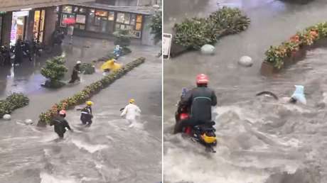 MOMENTO en el que repartidores rescatan a un niño arrastrado por inundación (VIDEO)